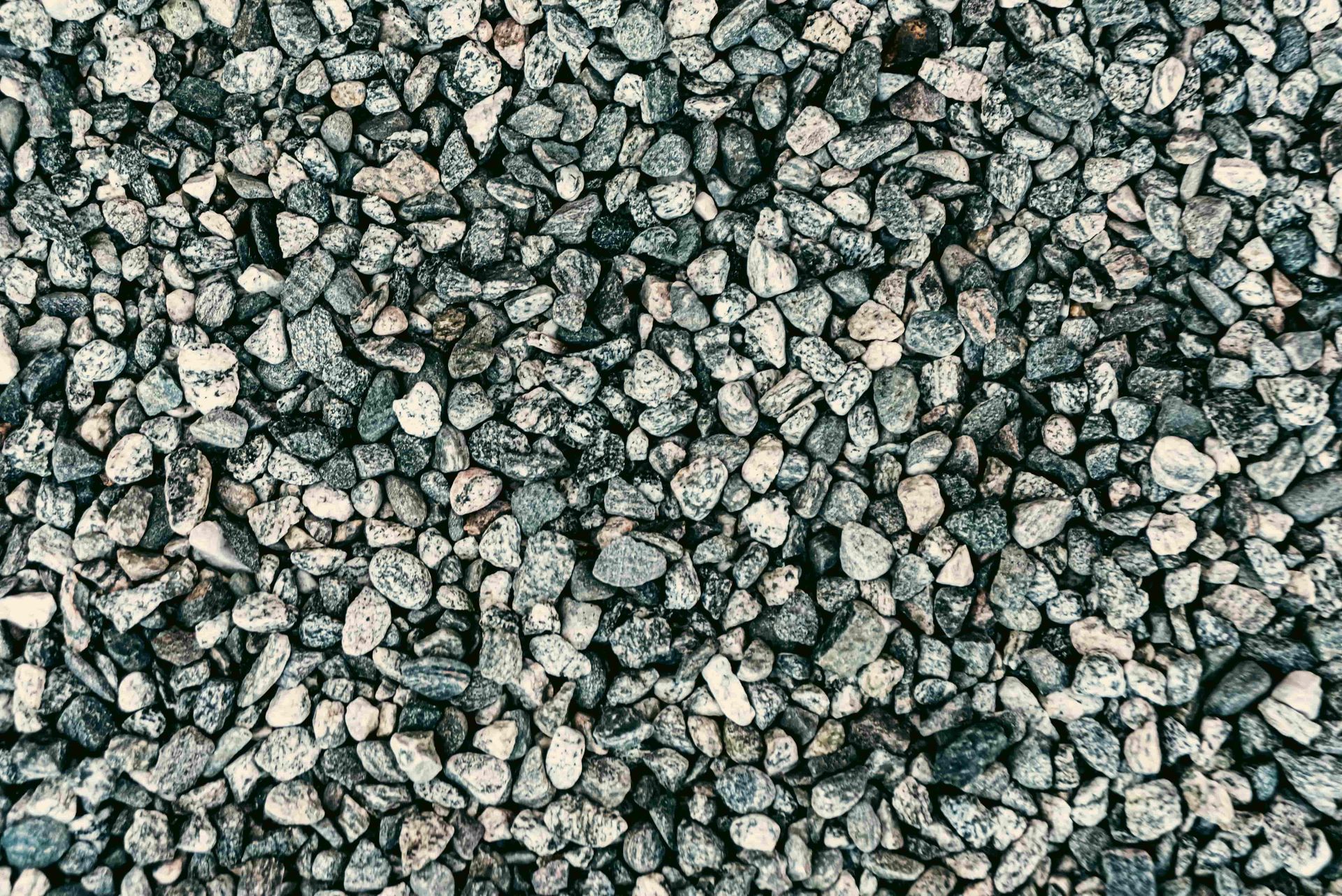 Close-up of gray gravel stones filling the frame.