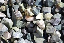 Pile of gray, white, and tan rocks and gravel