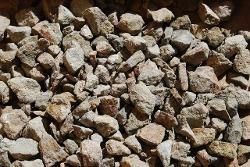 Close-up of a pile of small gray and tan rocks and gravel