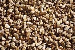 Close-up of small tan and brown gravel stones filling the frame