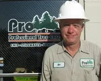 Man Tied-Up Tree Branch For Removal — Enid, OK — Professional Tree Care