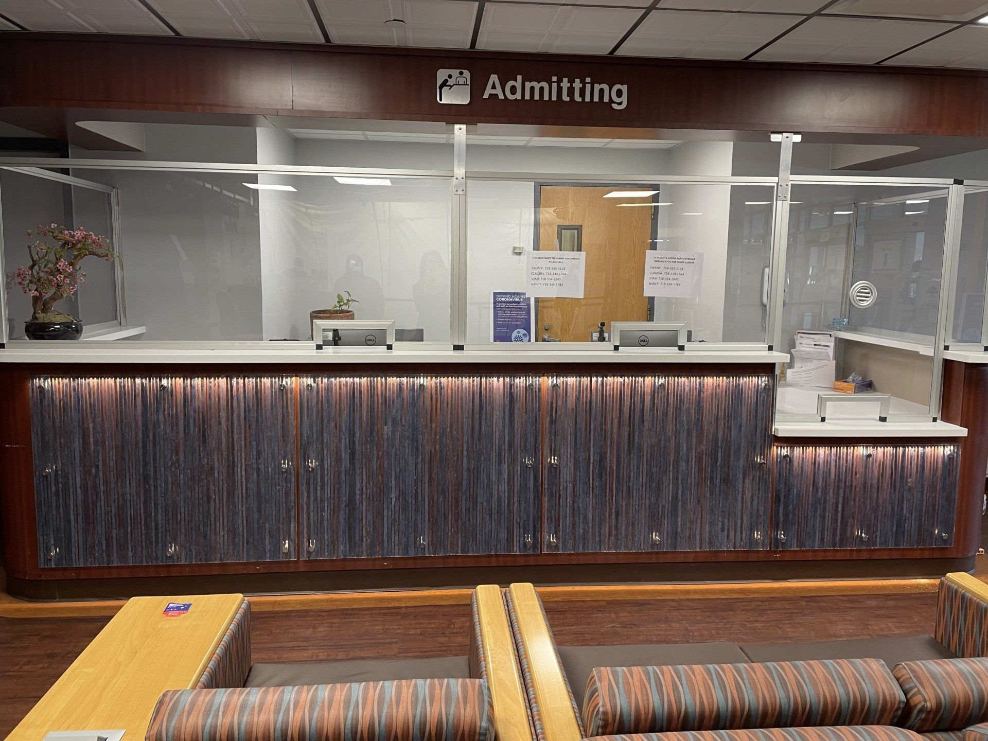 A waiting room with a sign that says admitting