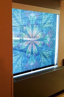 A window with a painting of a flower on it.