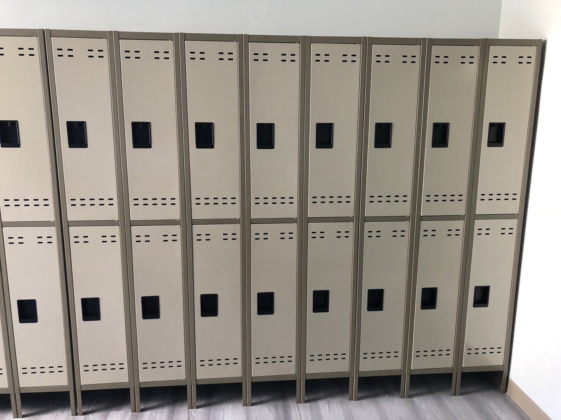 A row of lockers are lined up in a room