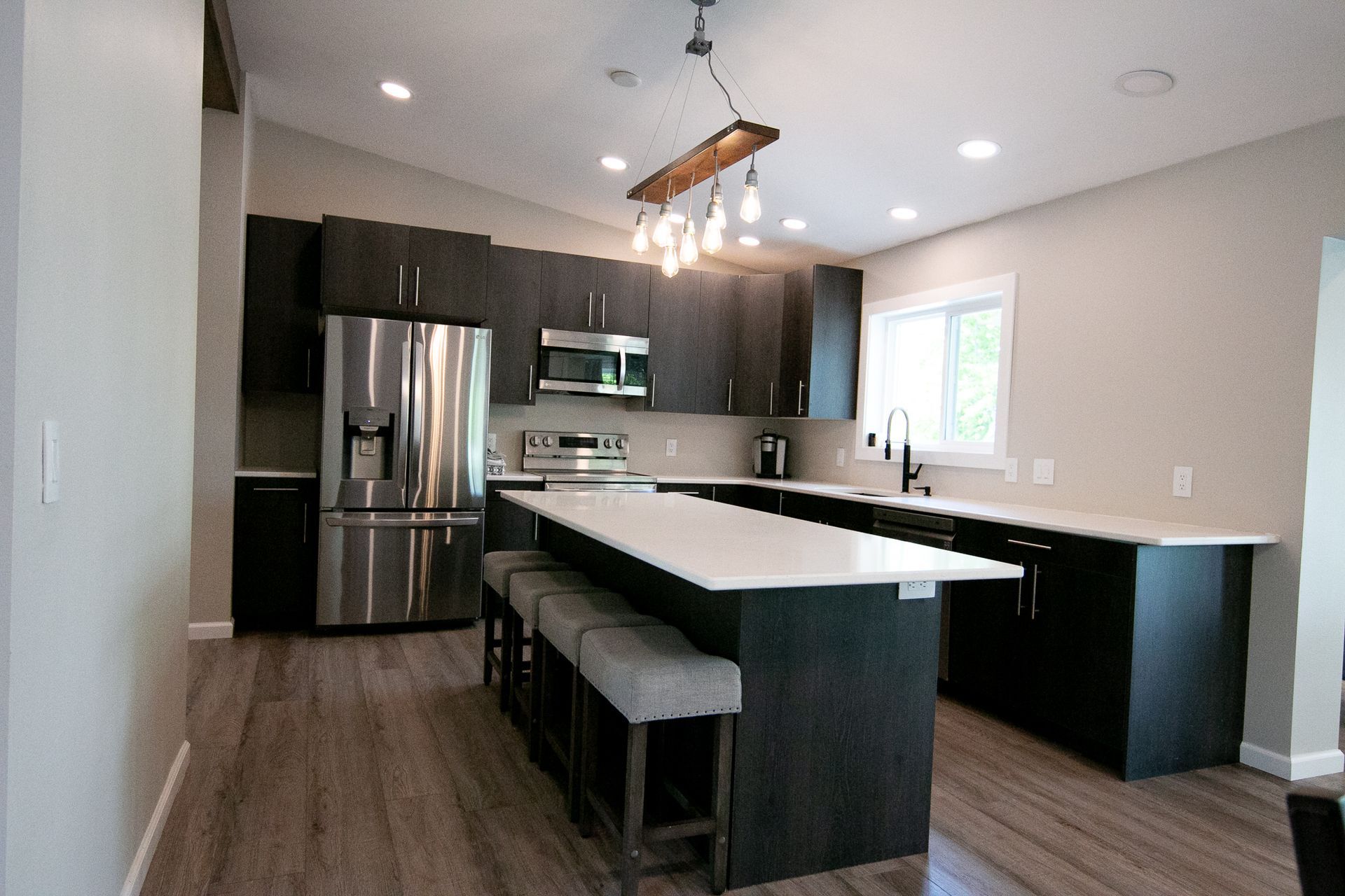 A kitchen with stainless steel appliances and a large island