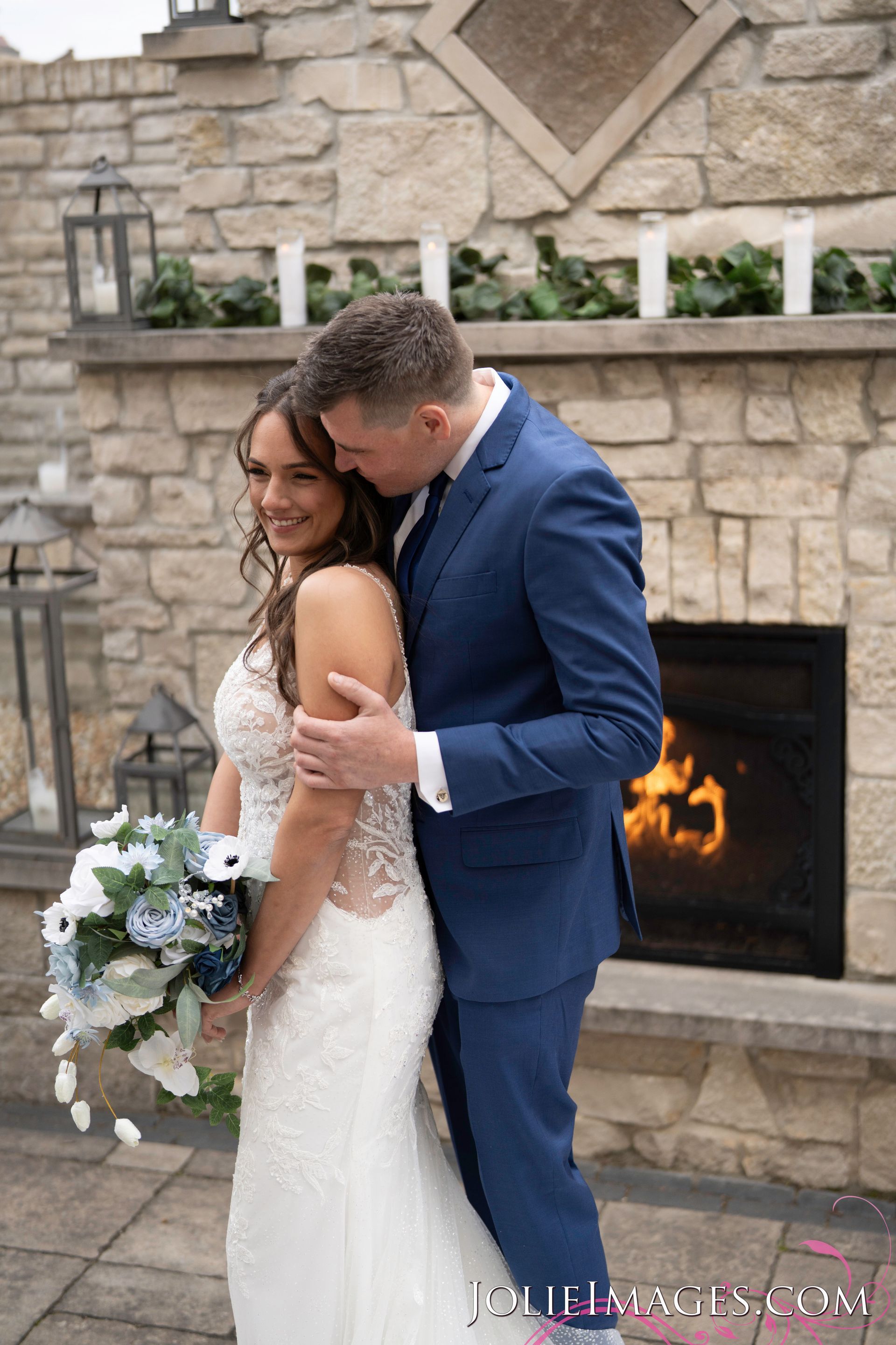 Couple by fireplace