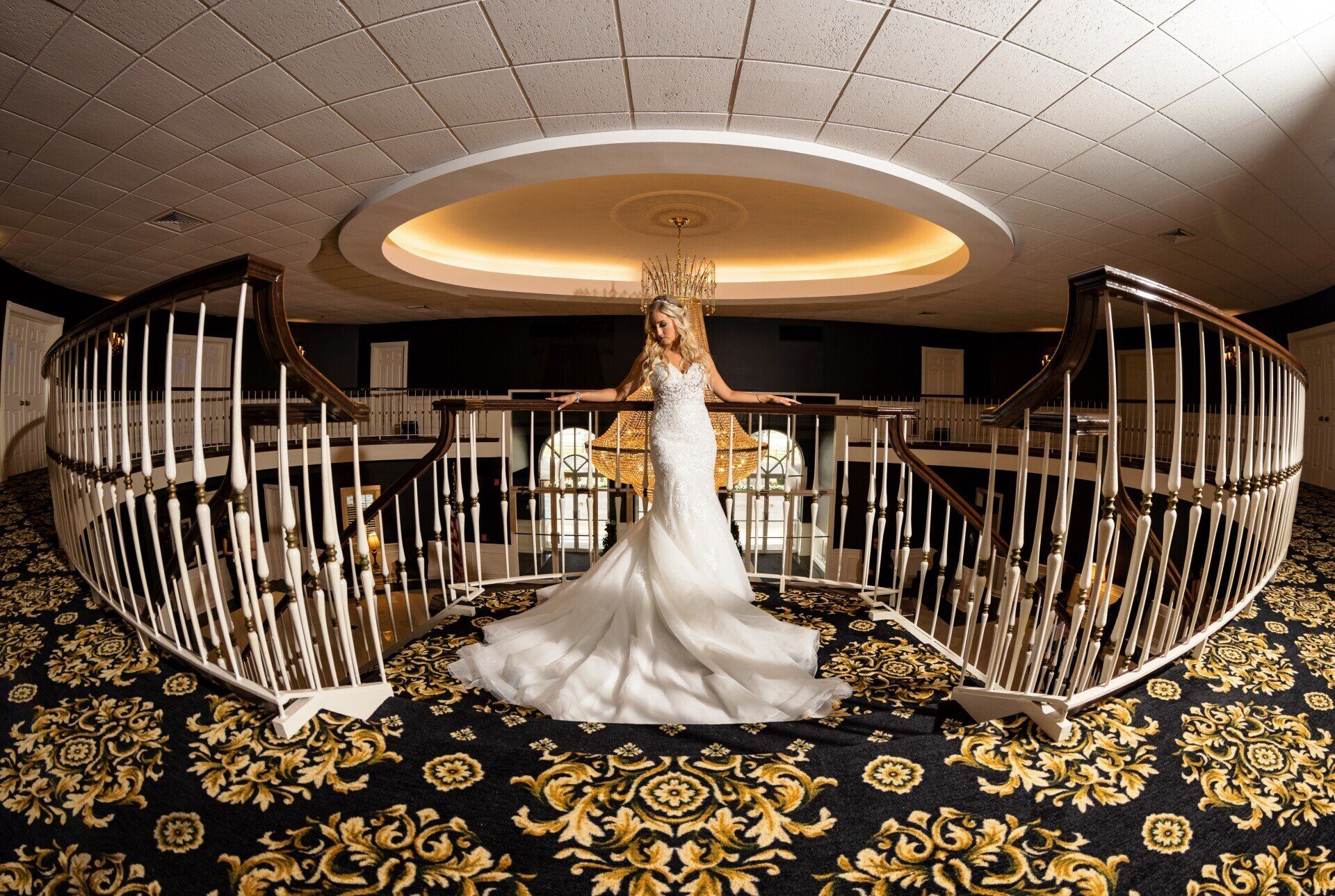 Bride in front of chandelier