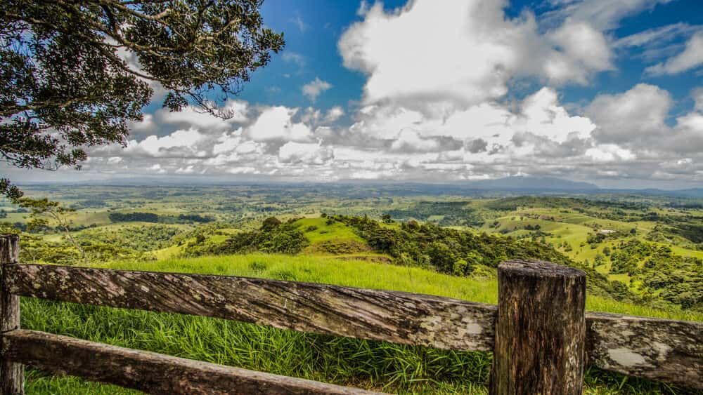 A Wooden Fence With A View Of A Lush Green Hillside — Allpower Electrical Wholesalers Pty Ltd In Atherton, QLD