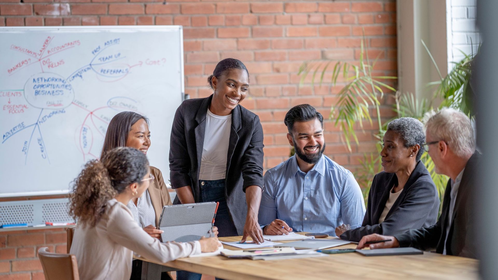 Group of happy people in corporate environment. 