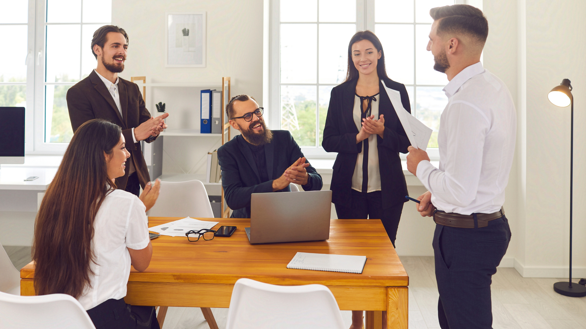 People in corporate setting, applauding