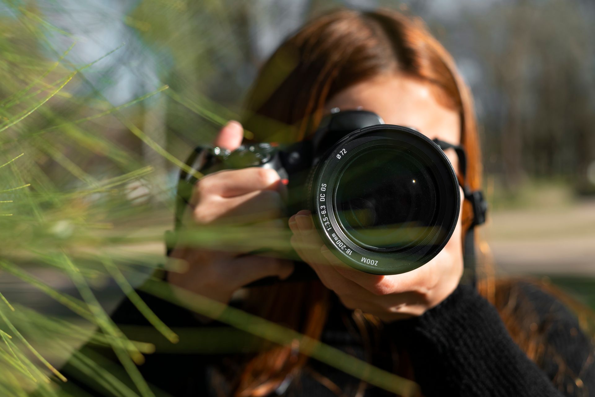Young photographer Ivetta Photos is capturing a moment with her camera, representing high quality photography services for any occasion.
