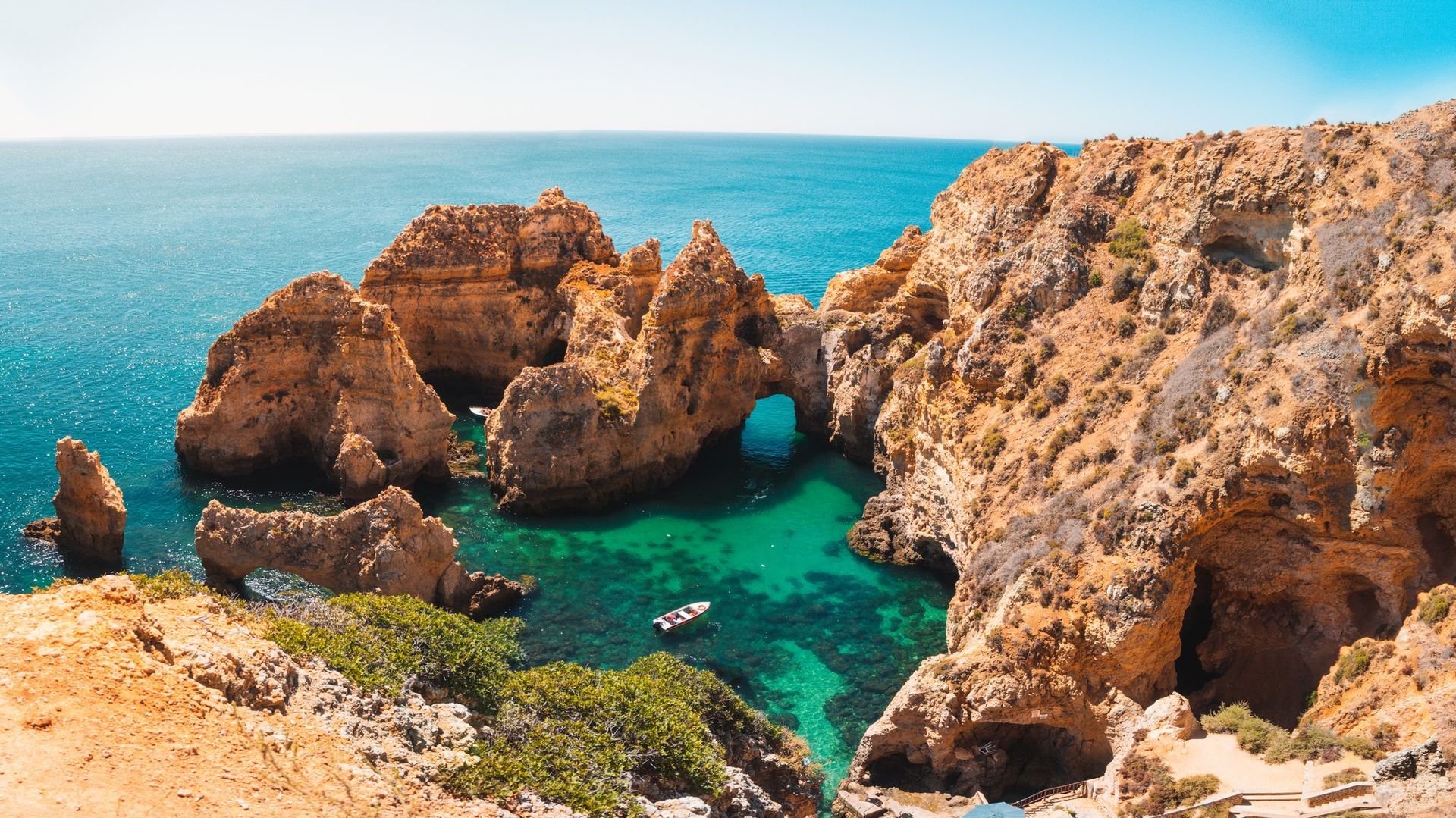 Stunning Algarve beach with golden cliffs, ideal for private excursions and scenic tours in Portugal and Spain.