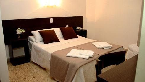 Habitación Standard - cama queen, cabecera en madera, vista Buenos Aires