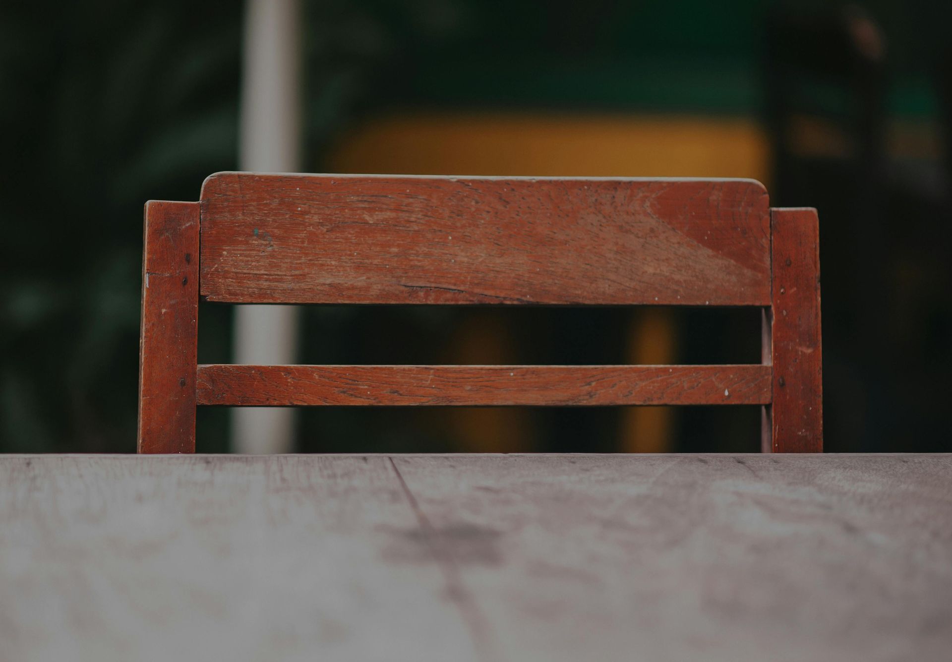 wood chair tucked in at desk