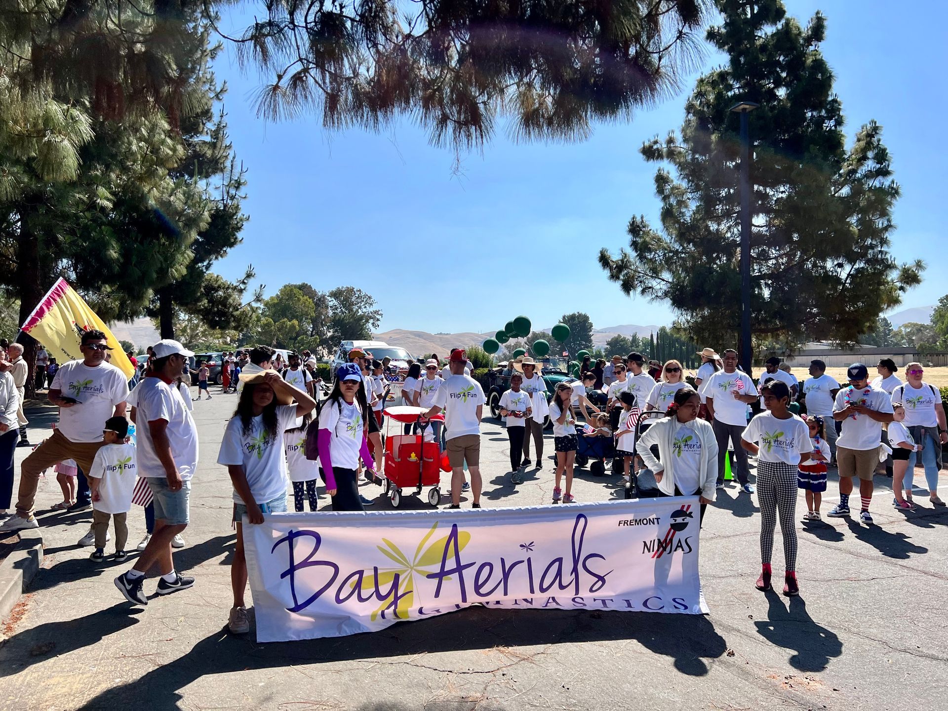 People in white shirts holding a