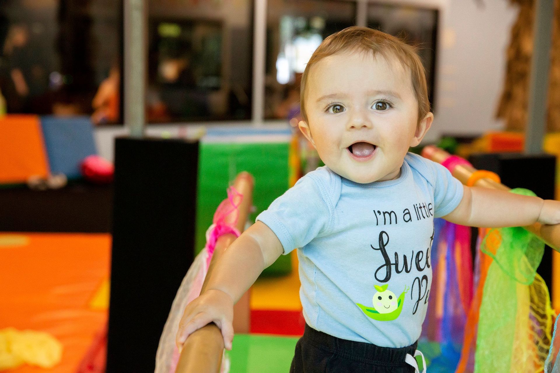 Smiling baby in a blue 