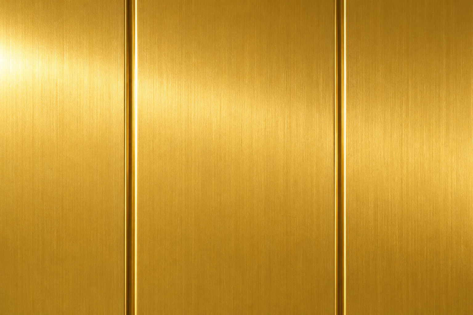Gold metallic surface with vertical brushed panels and narrow seams
