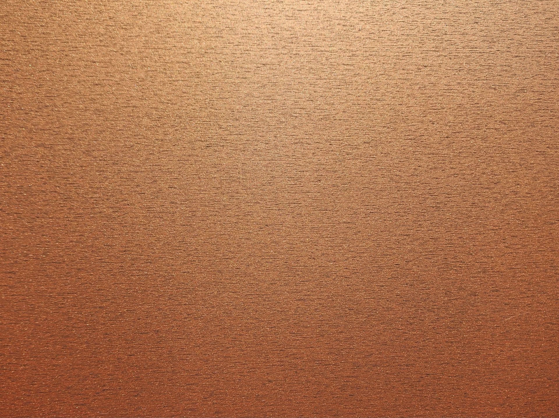 Textured brown-orange gradient background with a subtle speckled surface.
