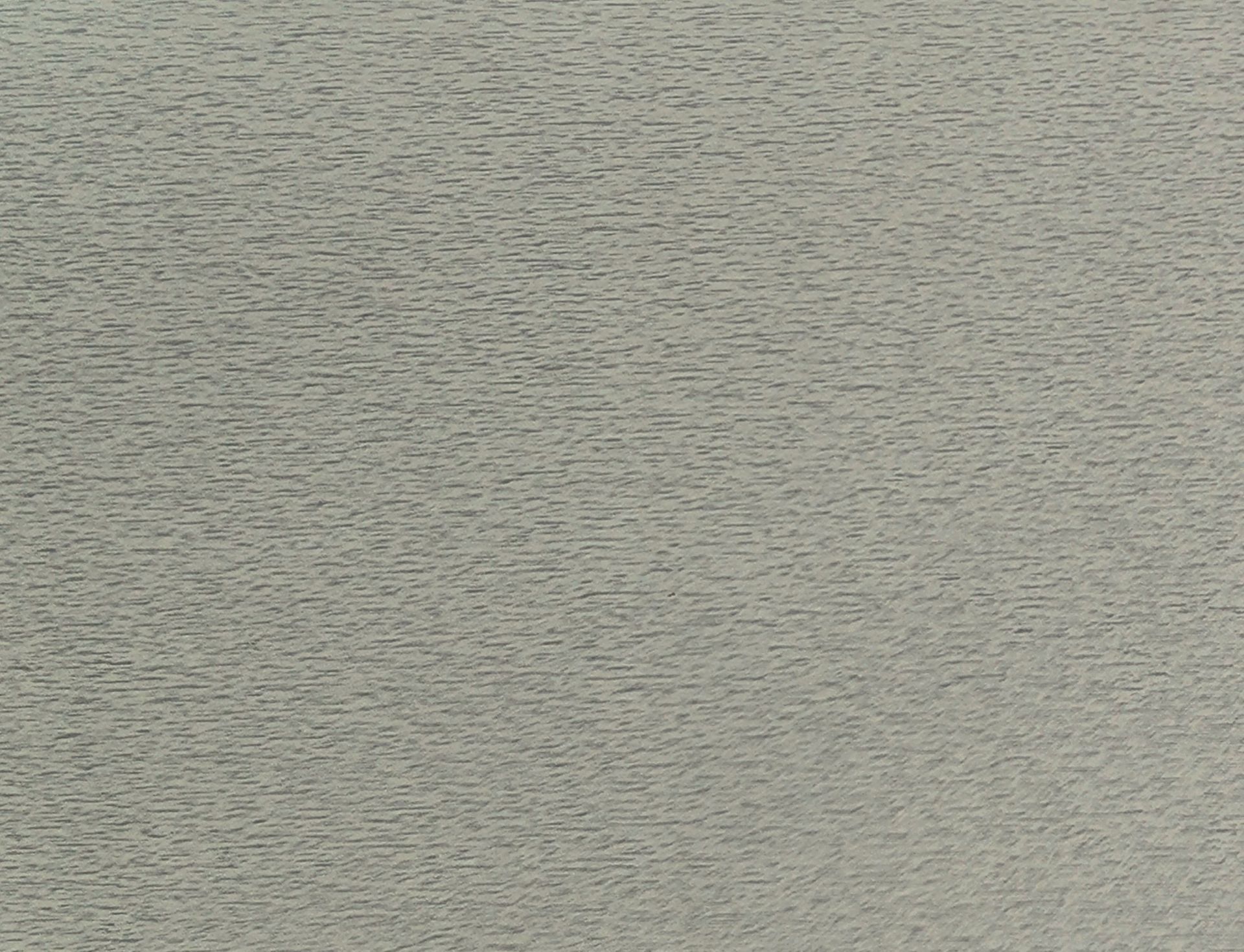 Close-up of a gray textured surface with subtle horizontal ripples