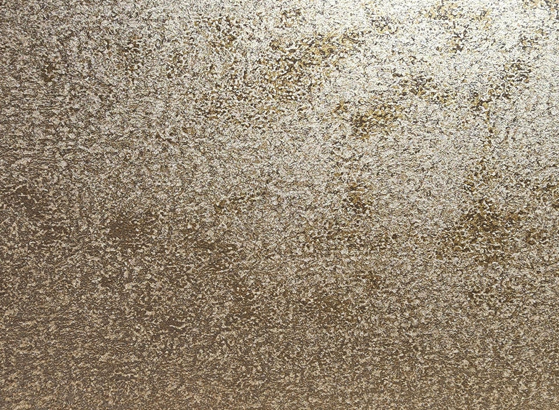 Close-up of a textured beige and white speckled surface