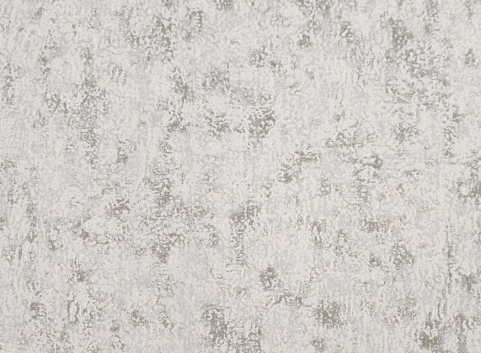 Light gray textured wall with subtle mottled pattern