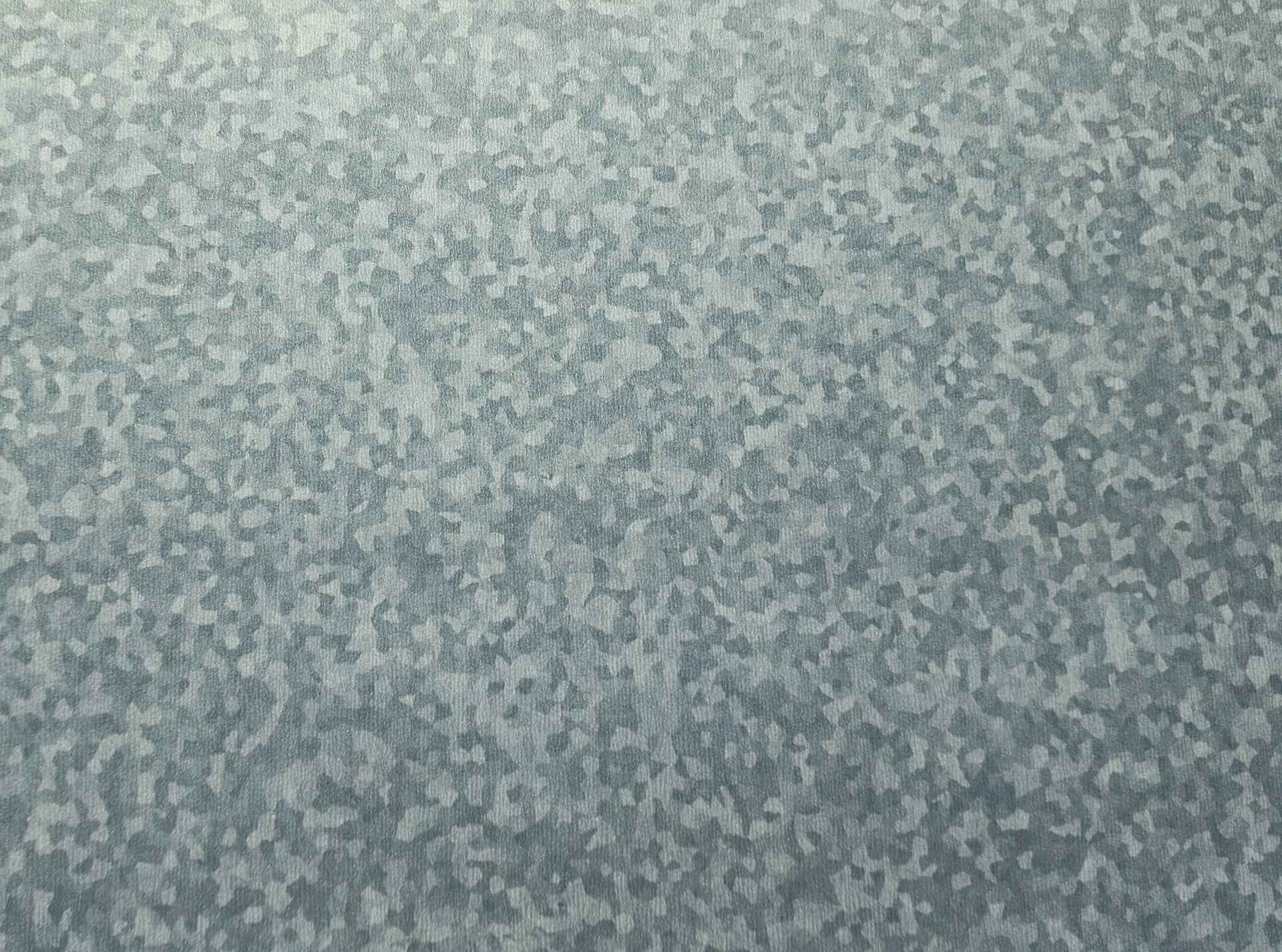 Close-up of a gray speckled textured surface