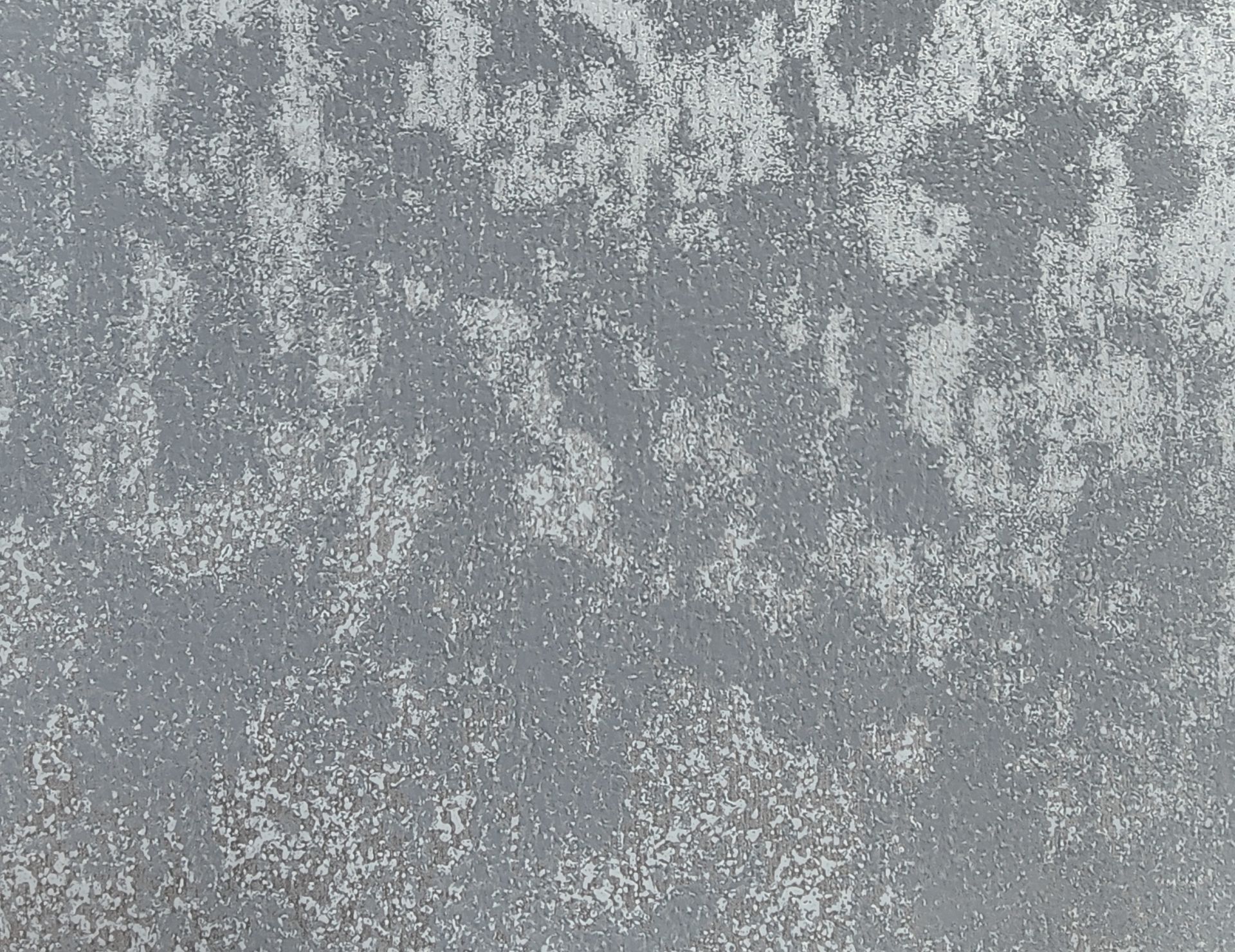 Gray textured concrete or stone surface with a speckled, weathered pattern
