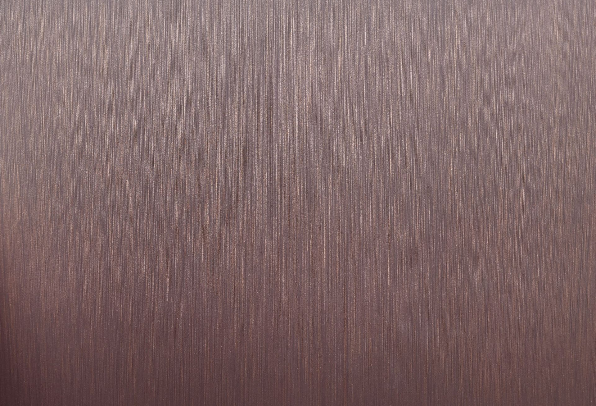 Close-up of a brown textured surface with vertical streaks