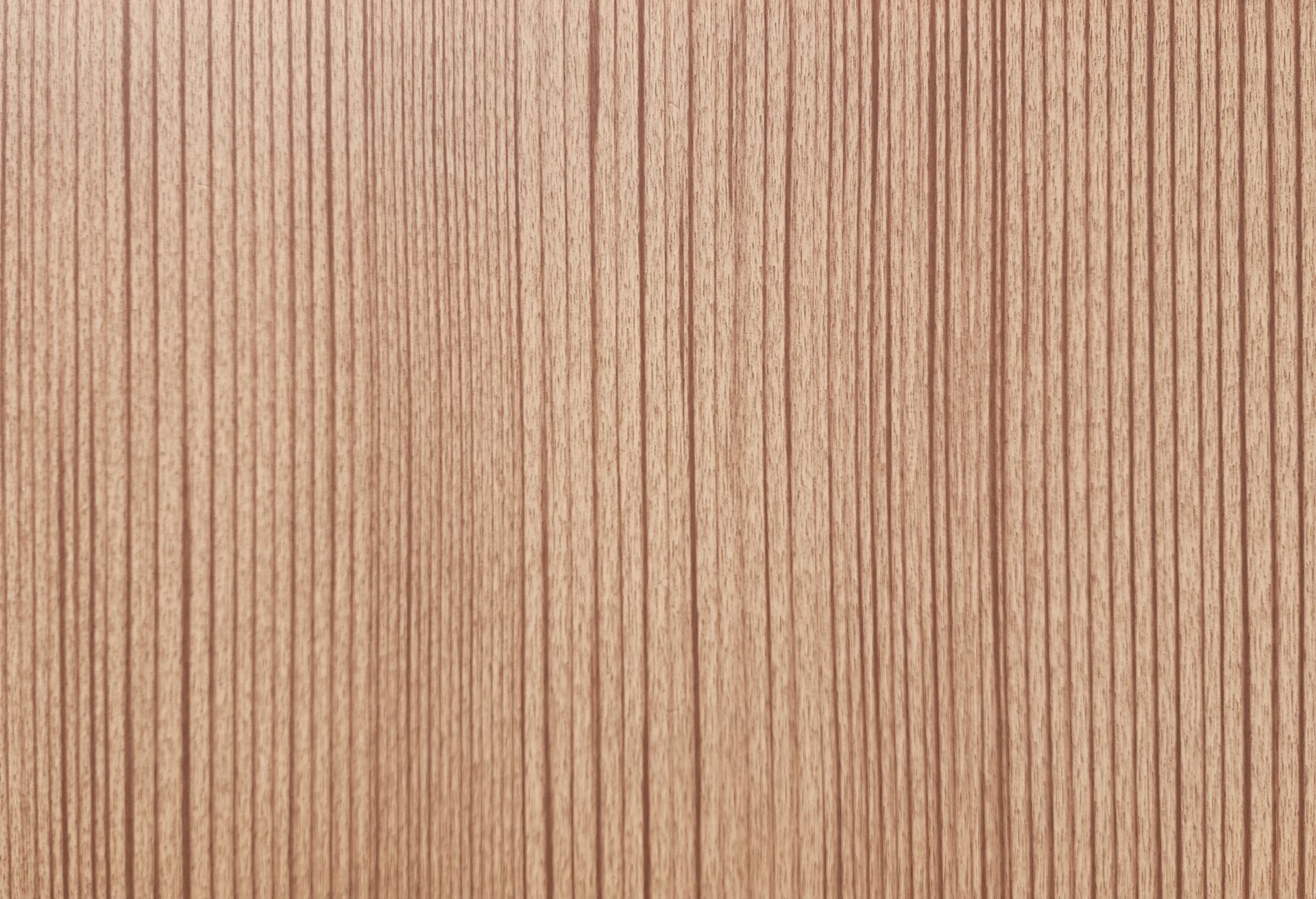 Close-up of light brown wood grain texture with vertical lines