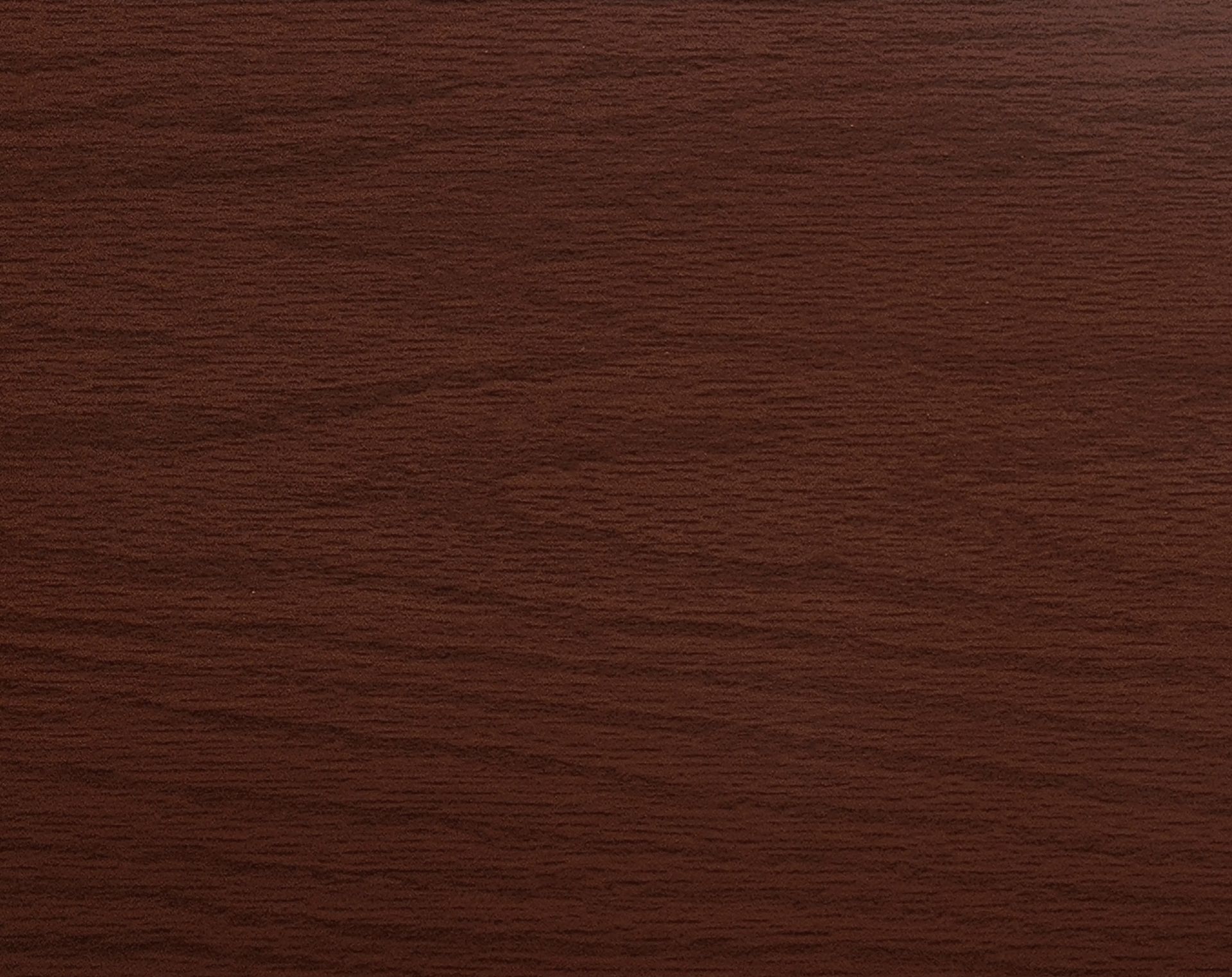 Close-up of a reddish-brown wood grain surface