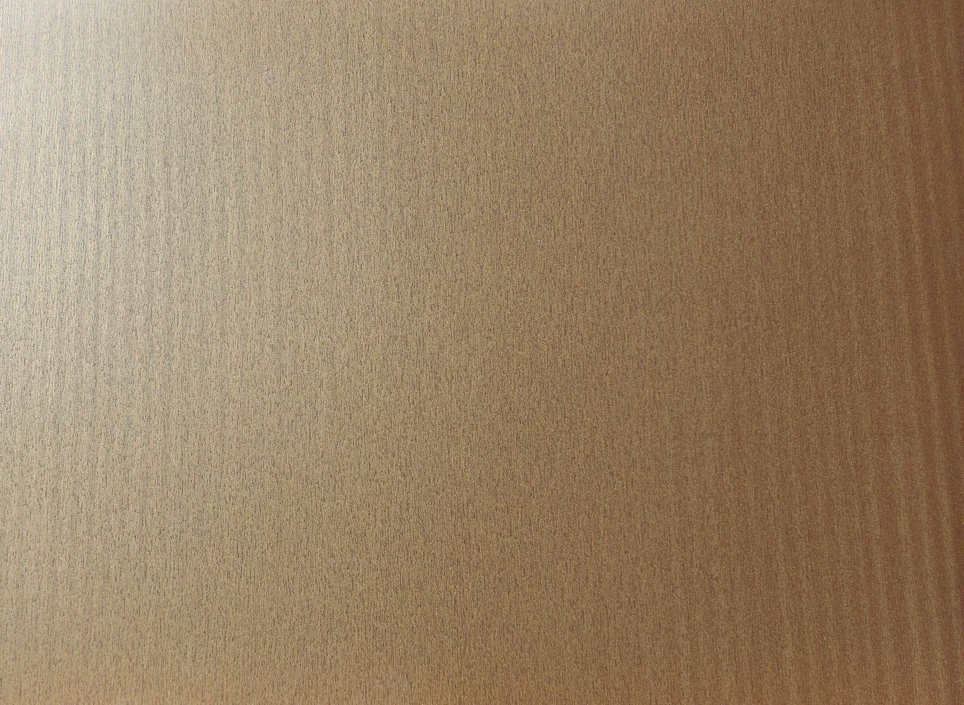 Textured tan-brown surface with a subtle gradient and fine grain pattern