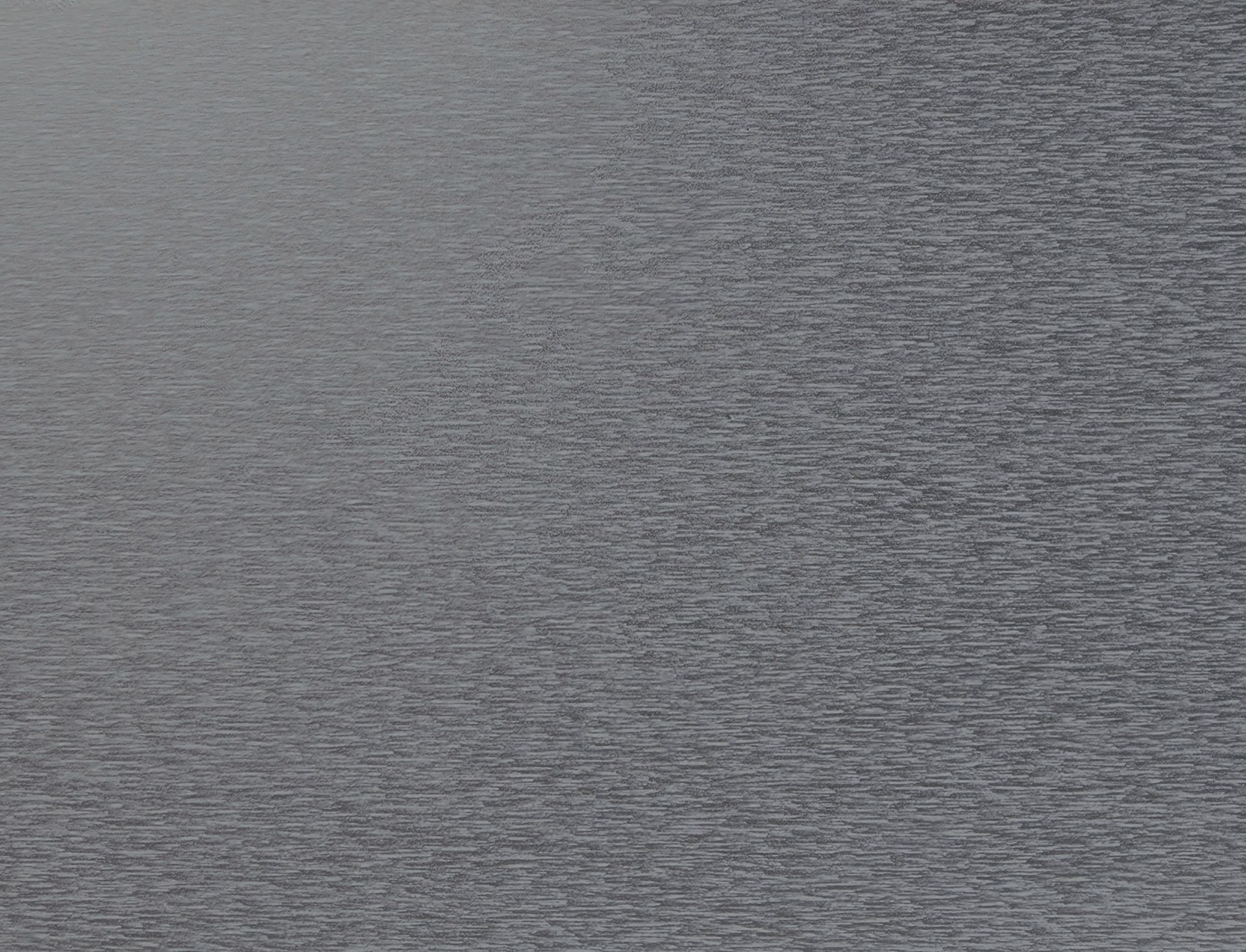 Gray textured fabric or paper surface with a subtle grain pattern