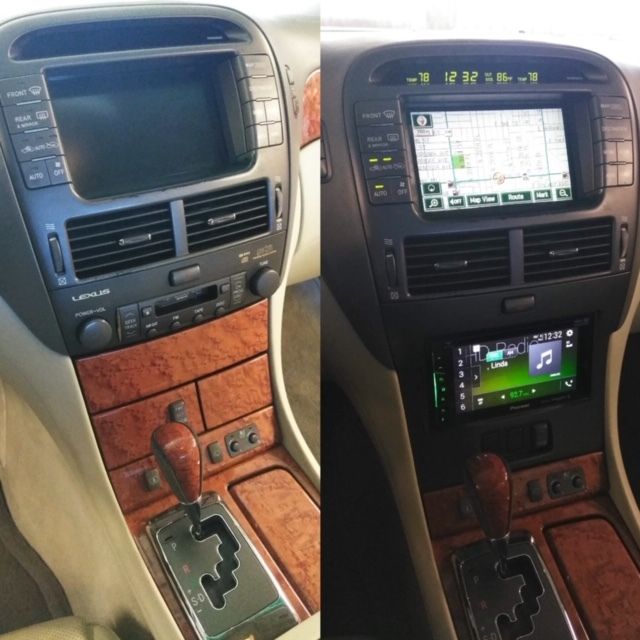Car interior center console before-and-after: old blank screen beside newer touchscreen navigation and stereo unit.