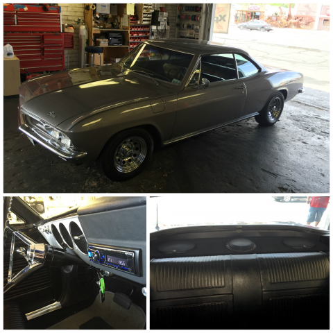 Classic dark gray muscle car in a garage, shown exterior, driver’s seat, and rear parcel shelf views.