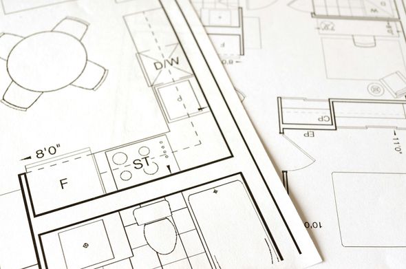 A black and white drawing of a kitchen and dining room