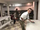 Two people in white shirts and ties playing pool in a basement game room