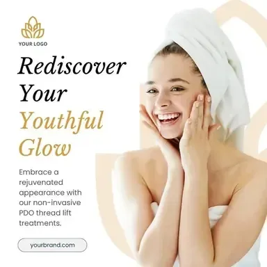 A woman with a towel wrapped around her head is smiling