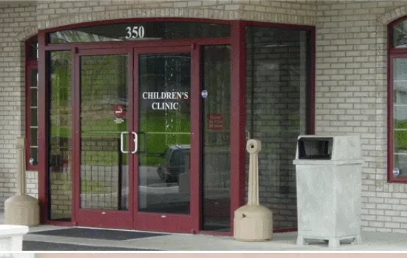Entrance to a Children's Clinic with burgundy doors, glass panels, and a number 350 above.