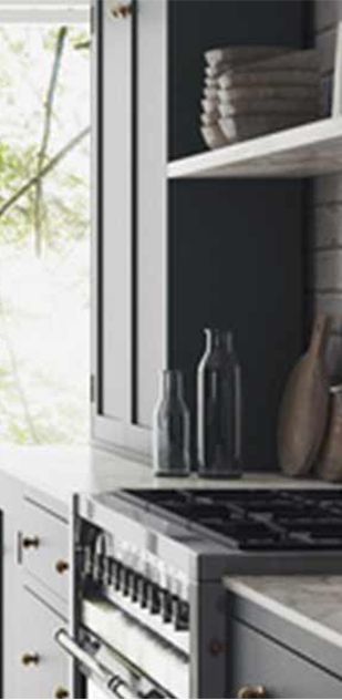 A kitchen with a stove top oven and a window.