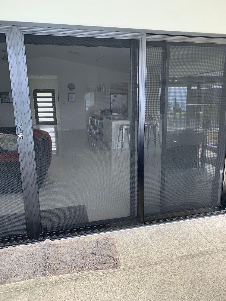 A Close Up of a Wrought Iron Door on a Building — Whitsunday Screens & Grilles In Proserpine, QLD