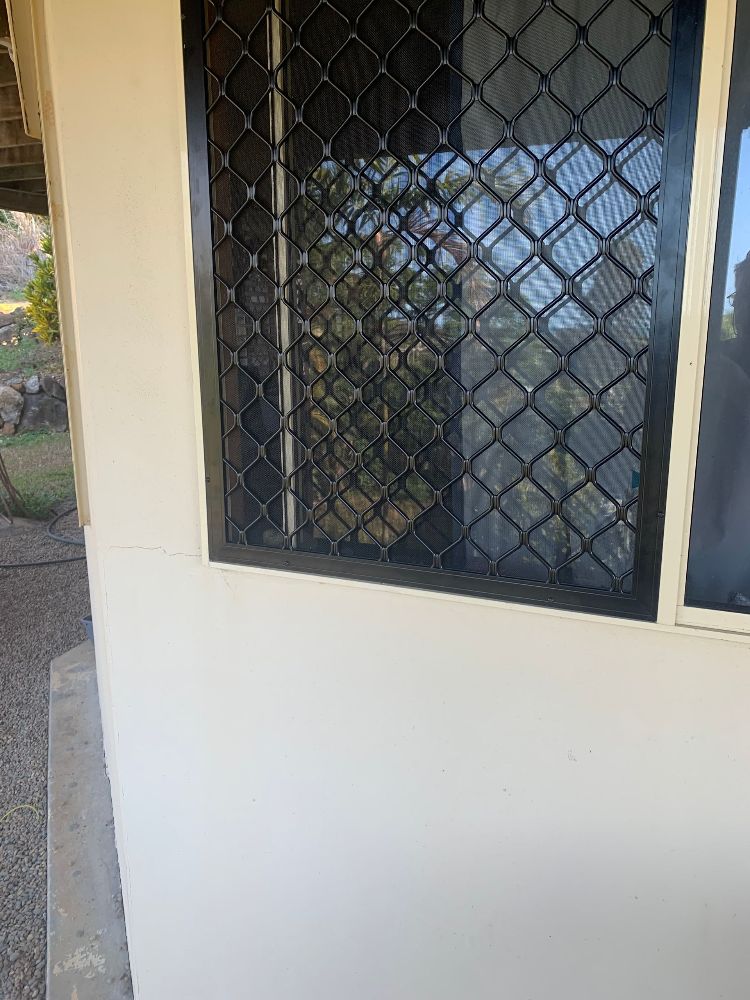 A Close Up of a Wrought Iron Door on a Building — Whitsunday Screens & Grilles In Proserpine, QLD