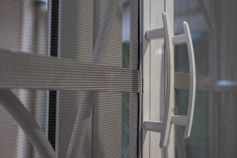 A Close Up of a White Handle on a Screen Door — Whitsunday Screens & Grilles In Bowen, QLD