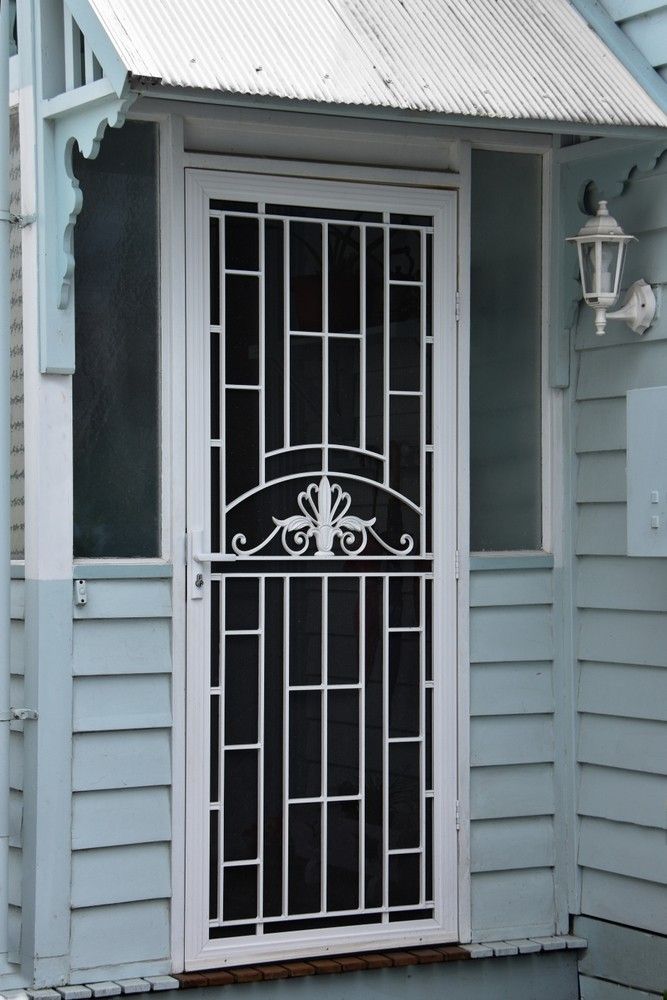 A White Door With a Black Screen on the Side of a House — Whitsunday Screens & Grilles In Proserpine, QLD