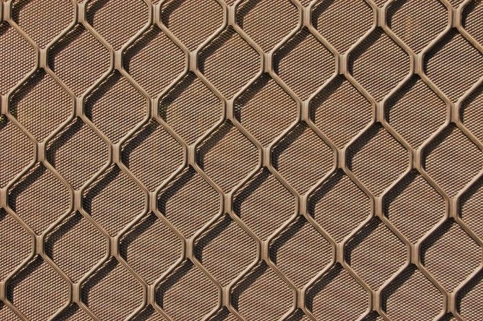 A Close Up of a Metal Fence With a Honeycomb Pattern — Whitsunday Screens & Grilles In Proserpine, QLD