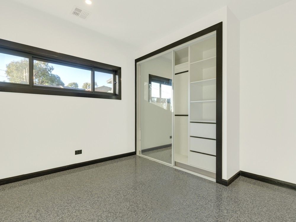 An Empty Room With a Sliding Glass Door and a Window — Whitsunday Screens & Grilles In Proserpine, QLD