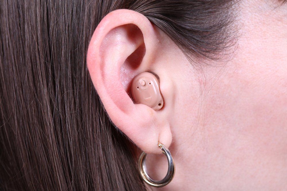 Woman Wearing Modern Hearing Aid — Belfast, ME — Hearing Solutions Woman Wearing Modern Hearing Aid — Belfast, ME — Hearing Solutions