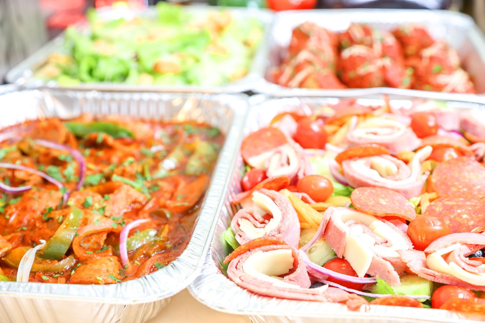Trays of assorted fresh seafood and vegetables at a market or buffet display