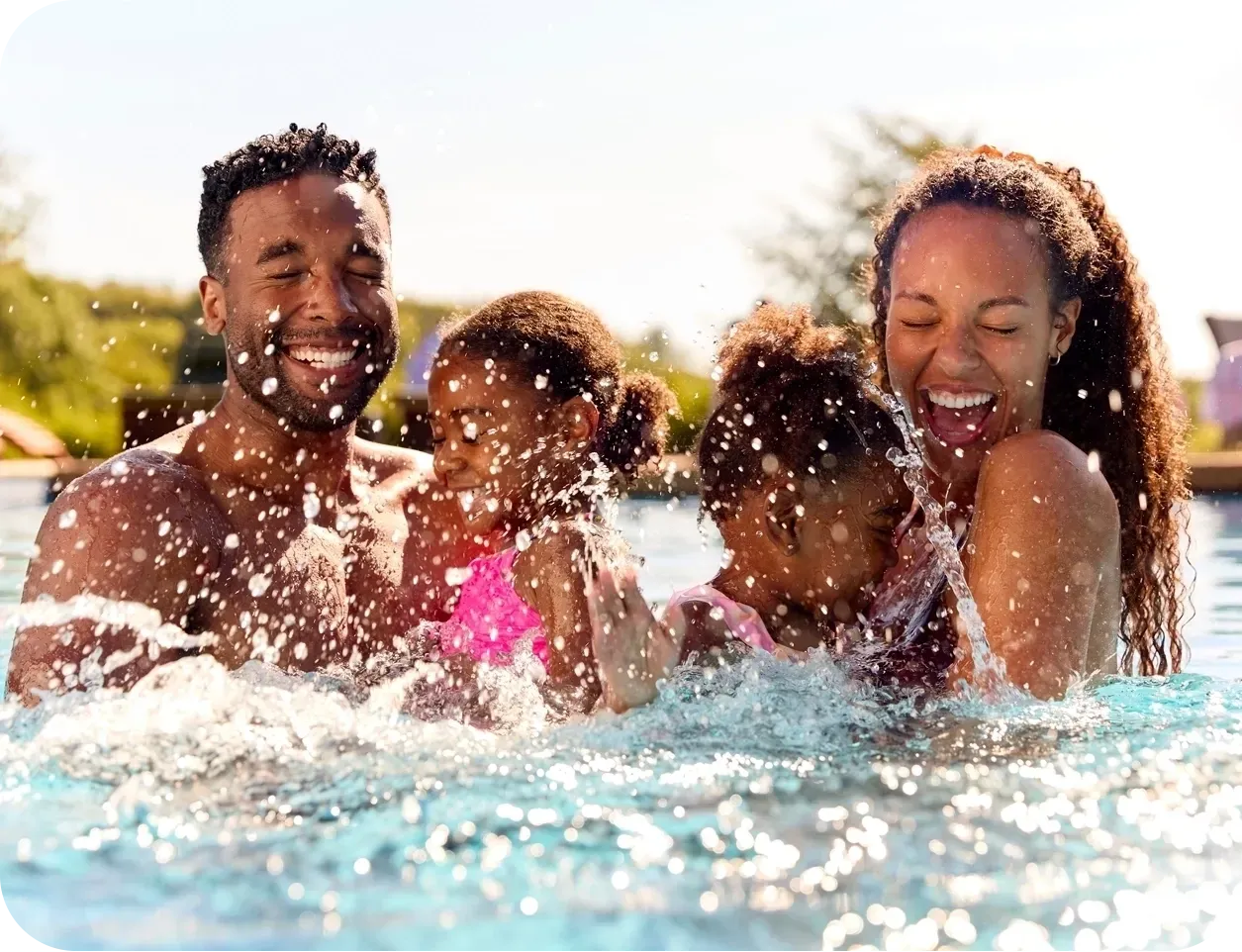 pool construction clients enjoying their new pool.