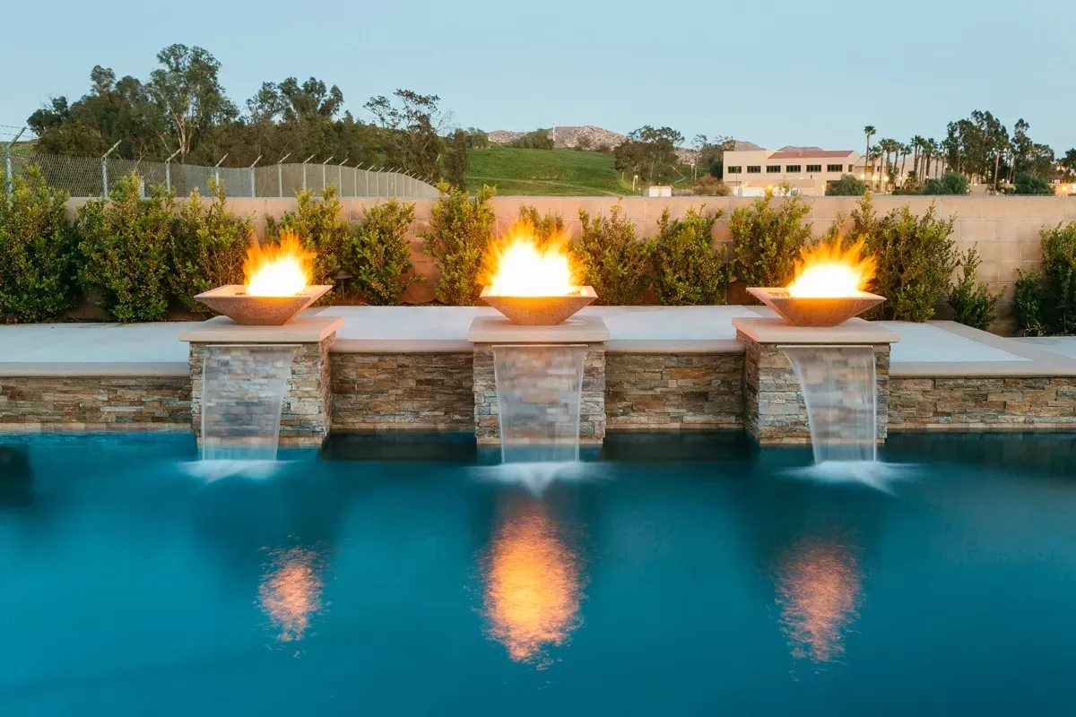 Modern fire and water features with custom swimming pool design and construction. Modern fire and water features with custom swimming pool design and construction.