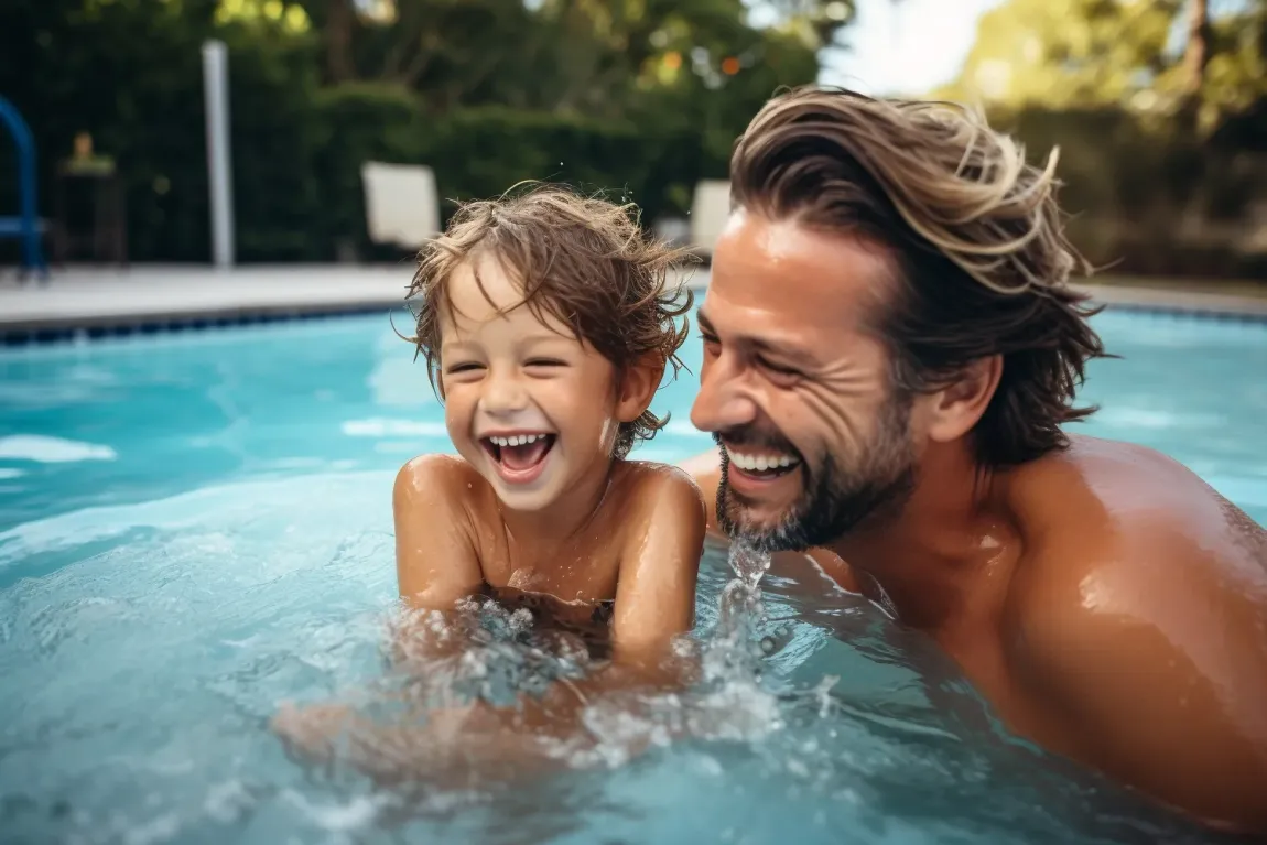 Father and son enjoying a new swimming pool. Father and son enjoying a new swimming pool.
